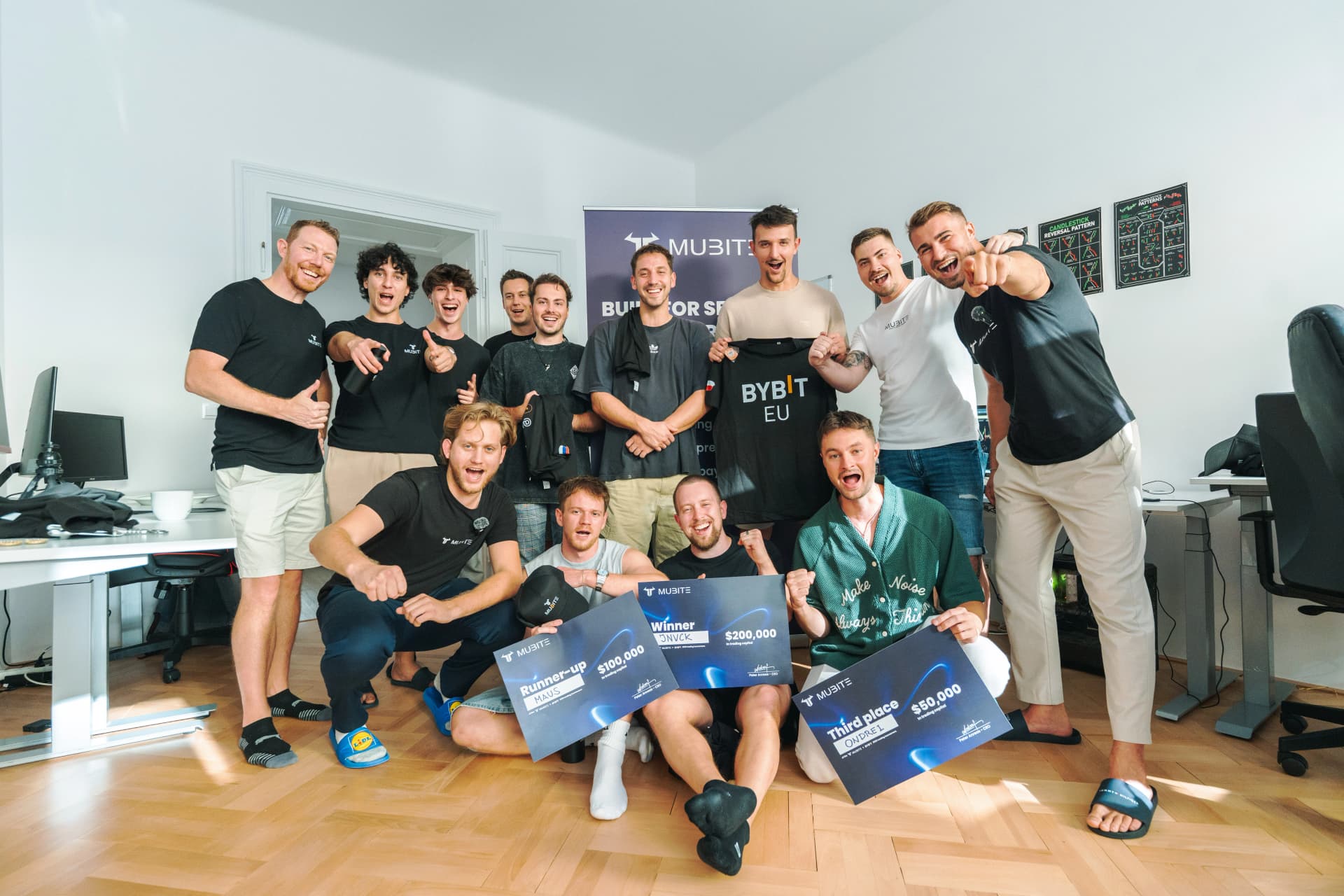 Winners of the Mubite live tournament in Prague holding their prize cheques